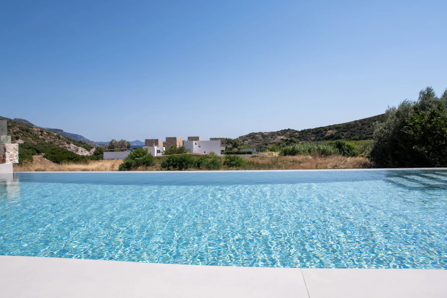 Infinity pool overlooking the Aegean, Stone Luxury Suites
